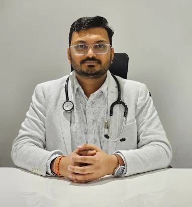 Portrait-style image used on Dr. Parag Chandak’s website, showing a doctor seated at a desk with a stethoscope, representing trusted care by the Best General Physician in Indore.